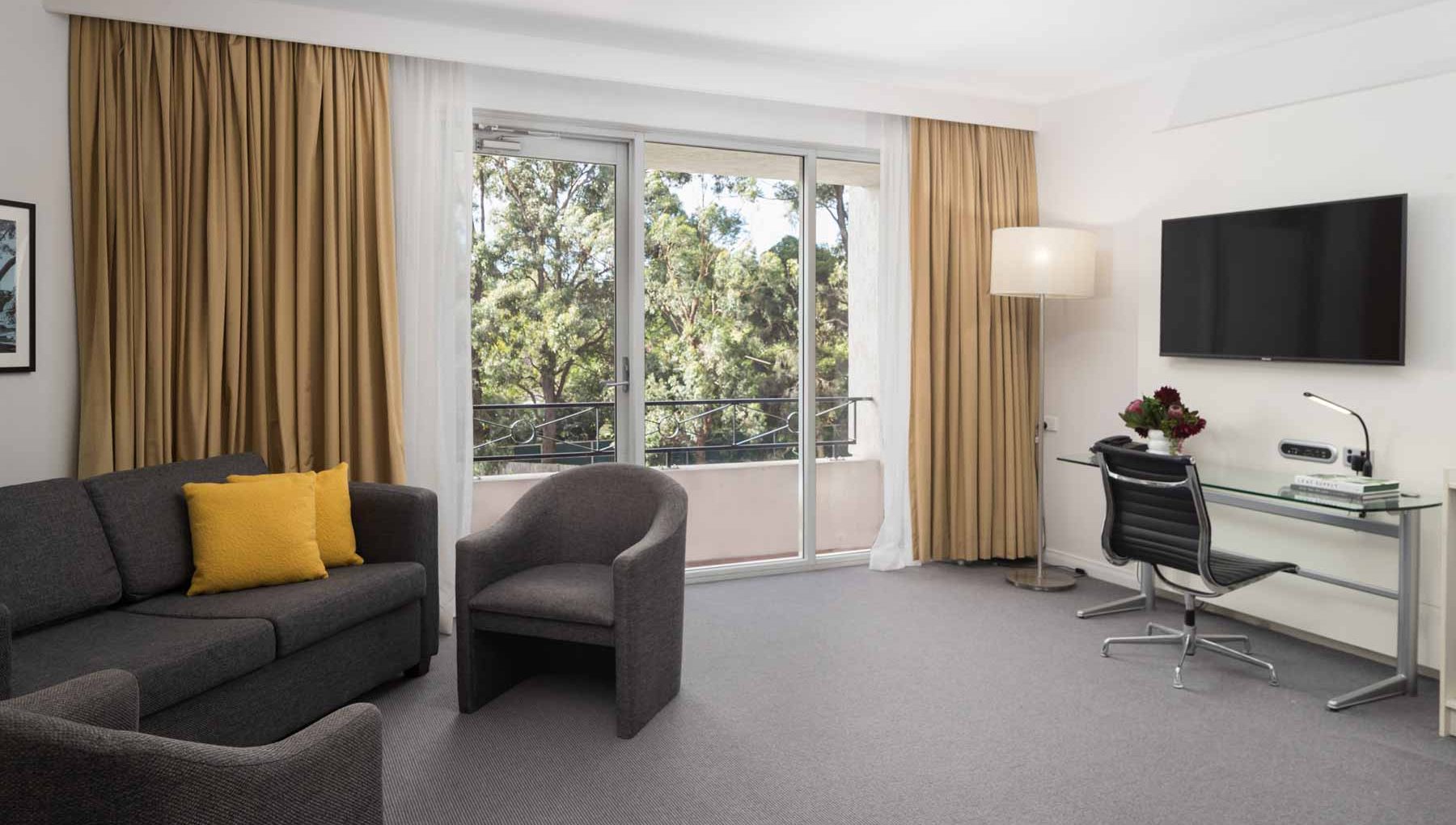 King Spa Suite - Couch and Window - Rydges Bankstown